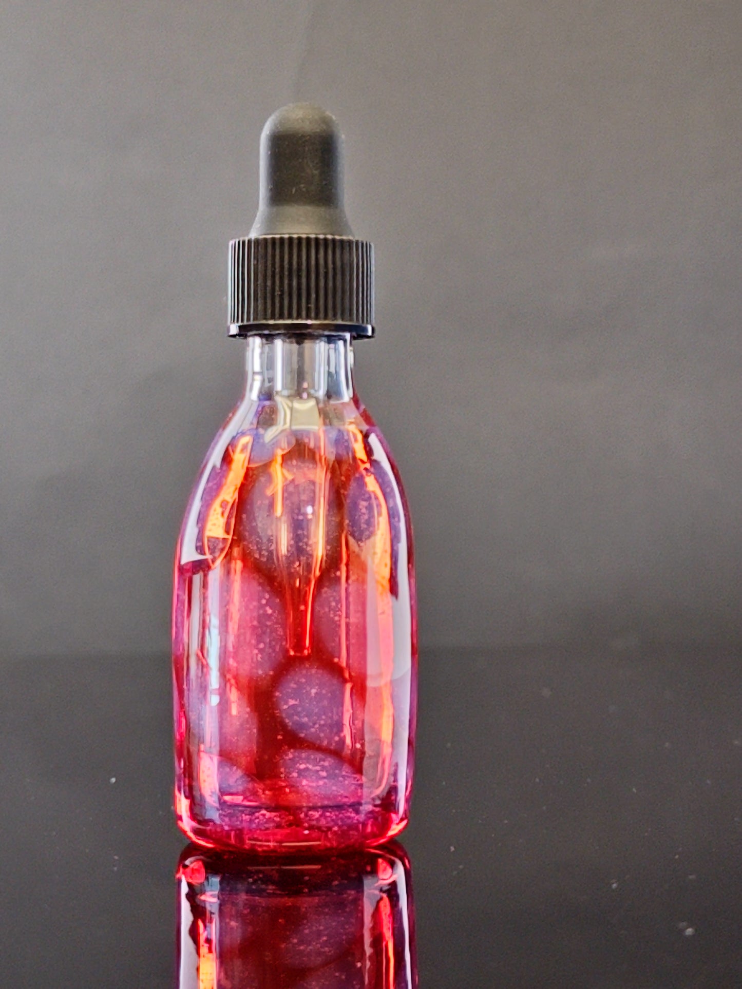 Transparent Red Spray Bottle