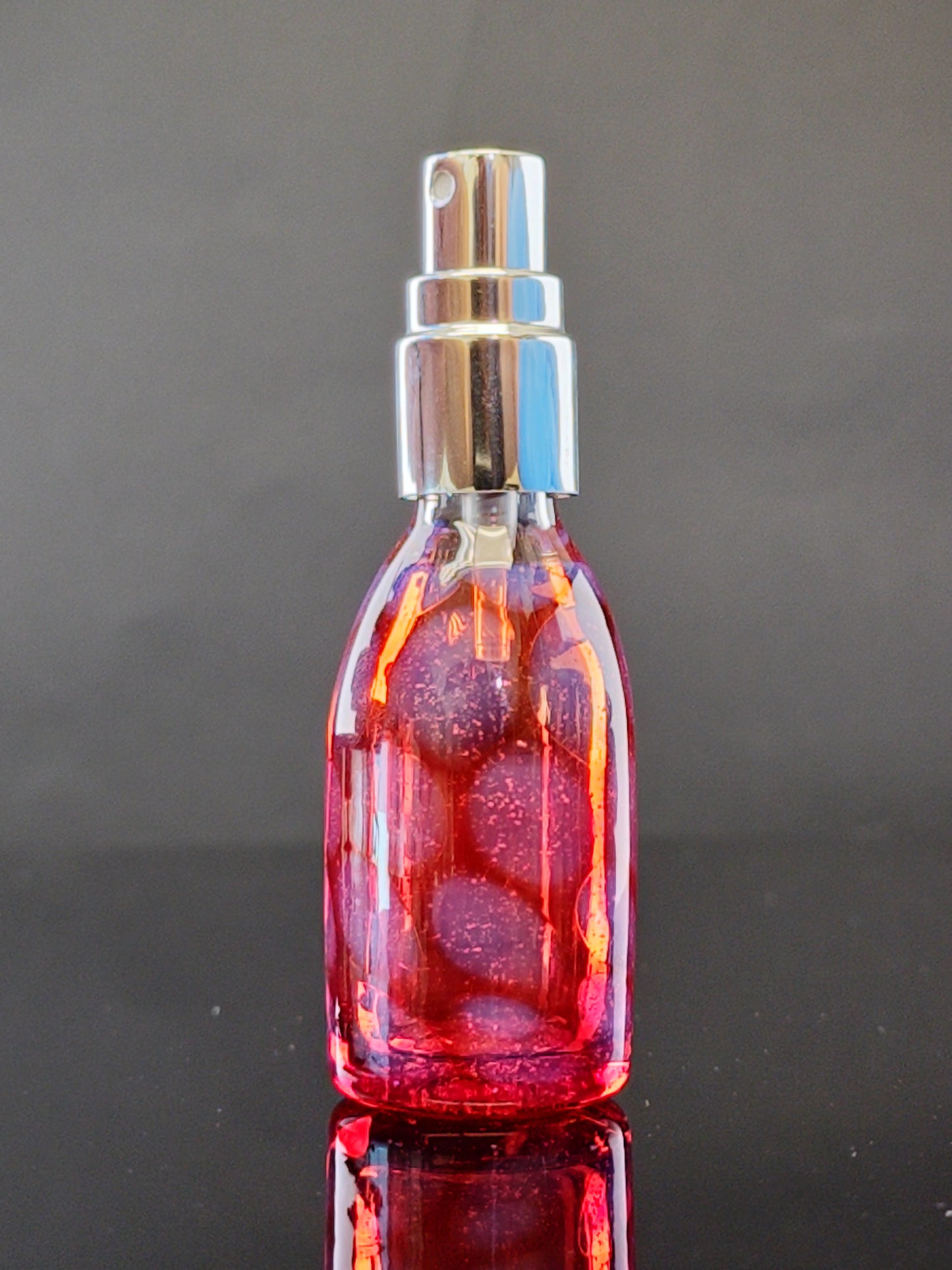 Transparent Red Spray Bottle