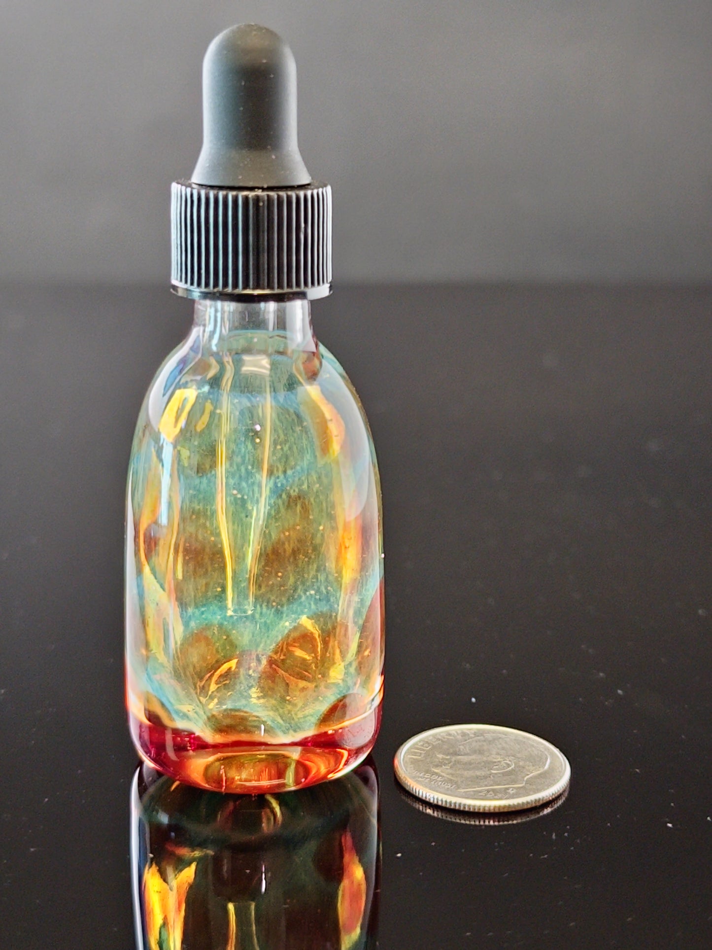 Transparent Green Dropper Bottle with Red Dots