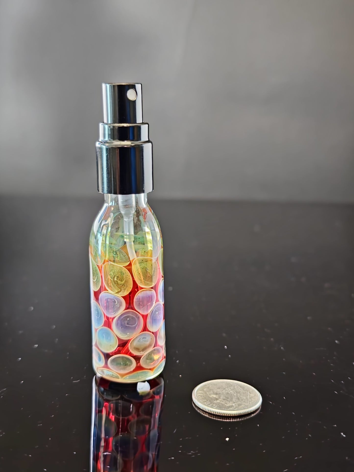 Red Spray Bottle with Purple/Green Dots