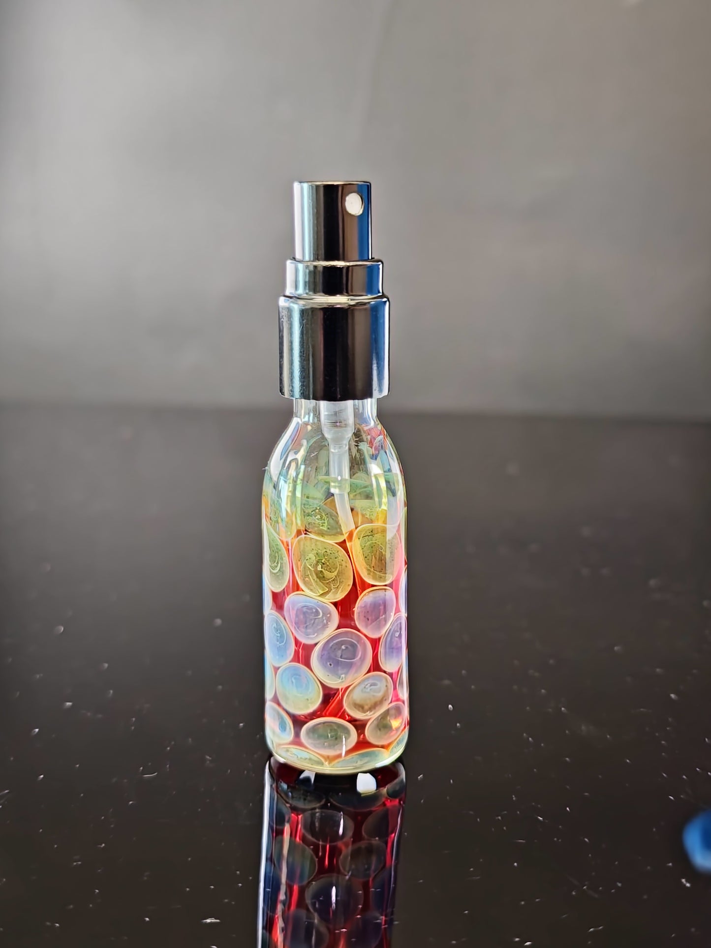 Red Spray Bottle with Purple/Green Dots