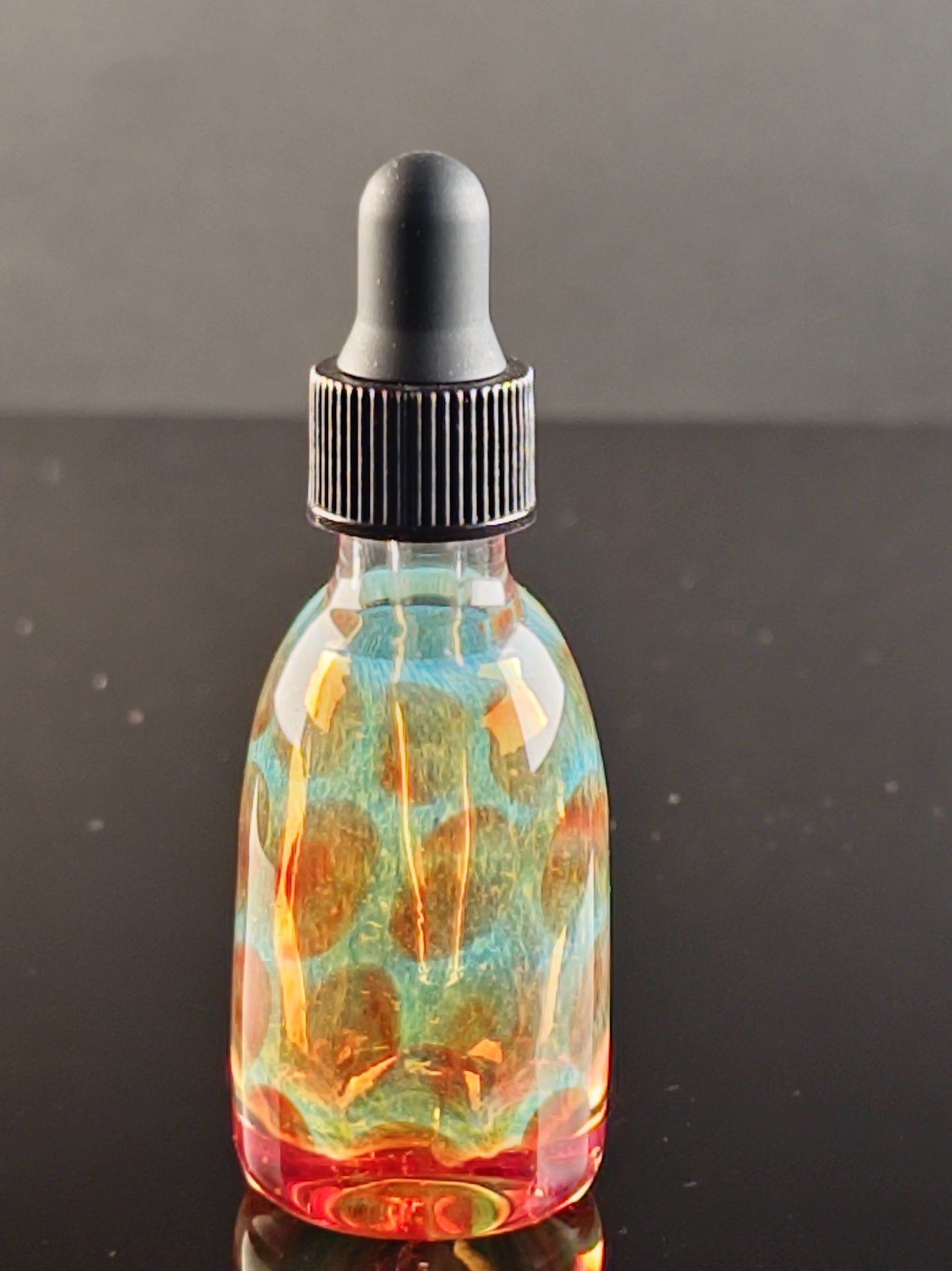 Transparent Green Dropper Bottle with Red Dots